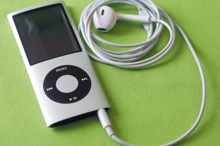 An ipod on a lime green background.