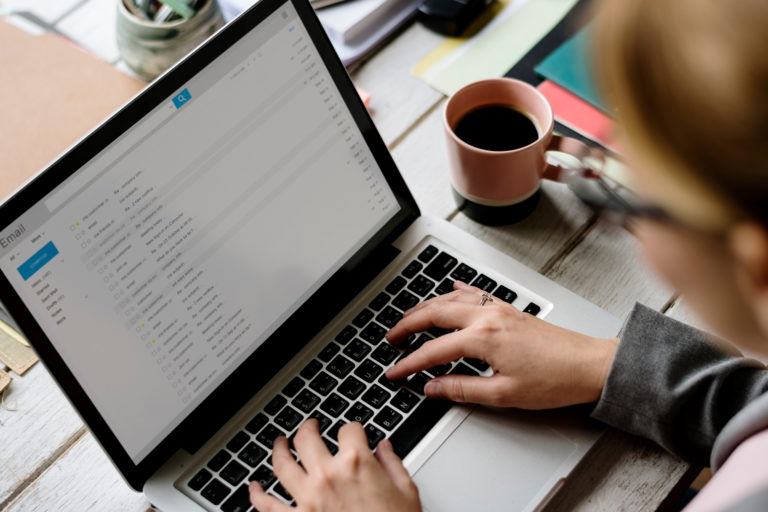 A person typing on a laptop.