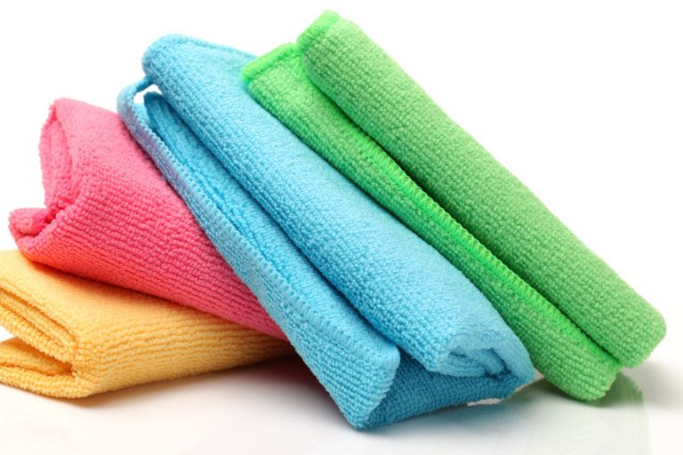 Four microfiber clothes of various colors.