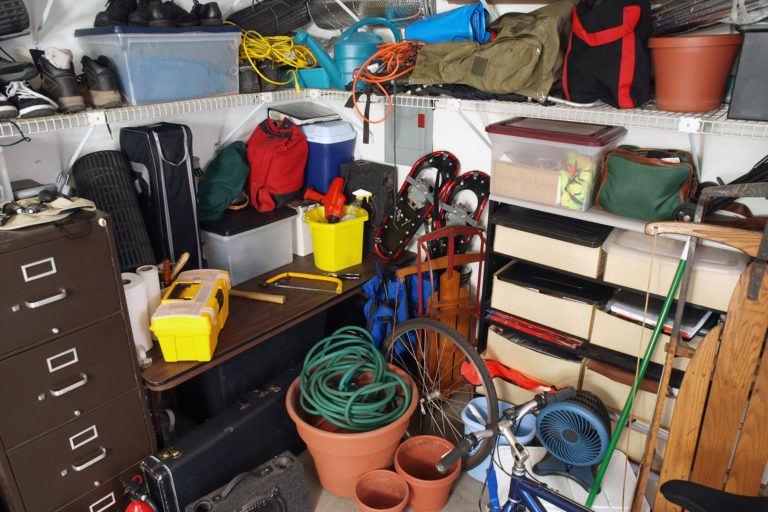 A messy corner of a garage.