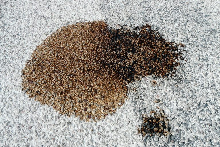 An oil stain on gravel.